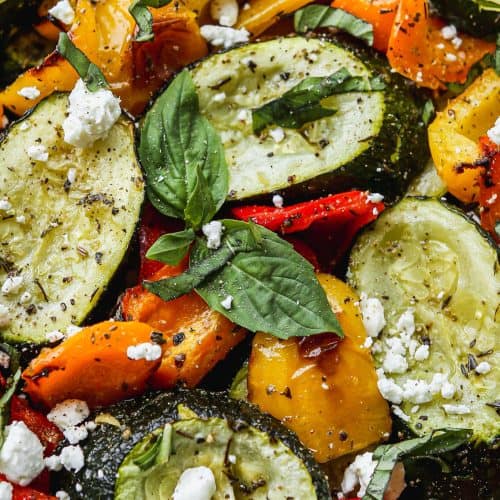 Fresh roasted vegetables including zucchini, bell peppers, and basil, ready for culinary use, featured on Bodacious Shops website.