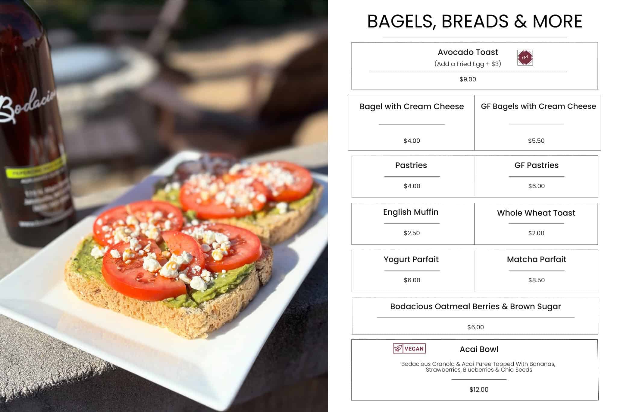 Avocado toast with tomato slices and feta cheese on whole grain bread, served on white plate at Bodacious Shops.
