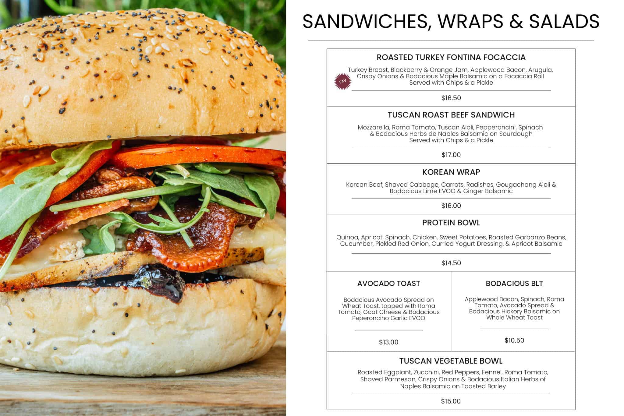 Close-up of a gourmet sandwich with fresh vegetables and toasted bun at Bodacious Shops Café in Janesville, Wisconsin. Perfect for breakfast, lunch, or a quick snack.